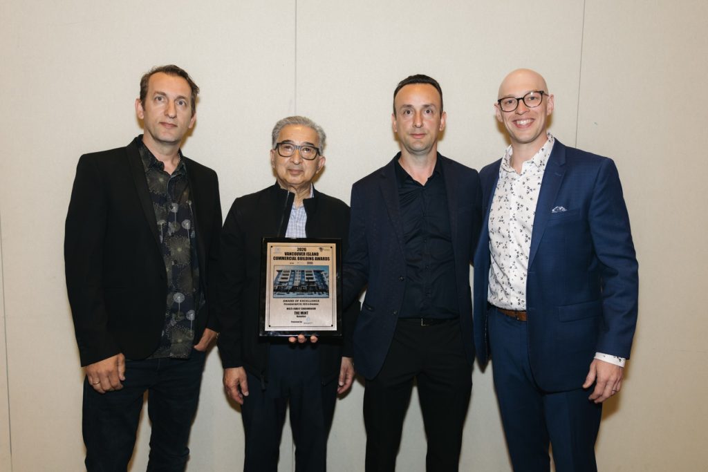 The Westmark construction leadership team at the 2026 Vancouver Island Commercial Building Awards, holding an Award of Excellence plaque for the Multi-Family Condominium category for The Mint in Nanaimo, BC